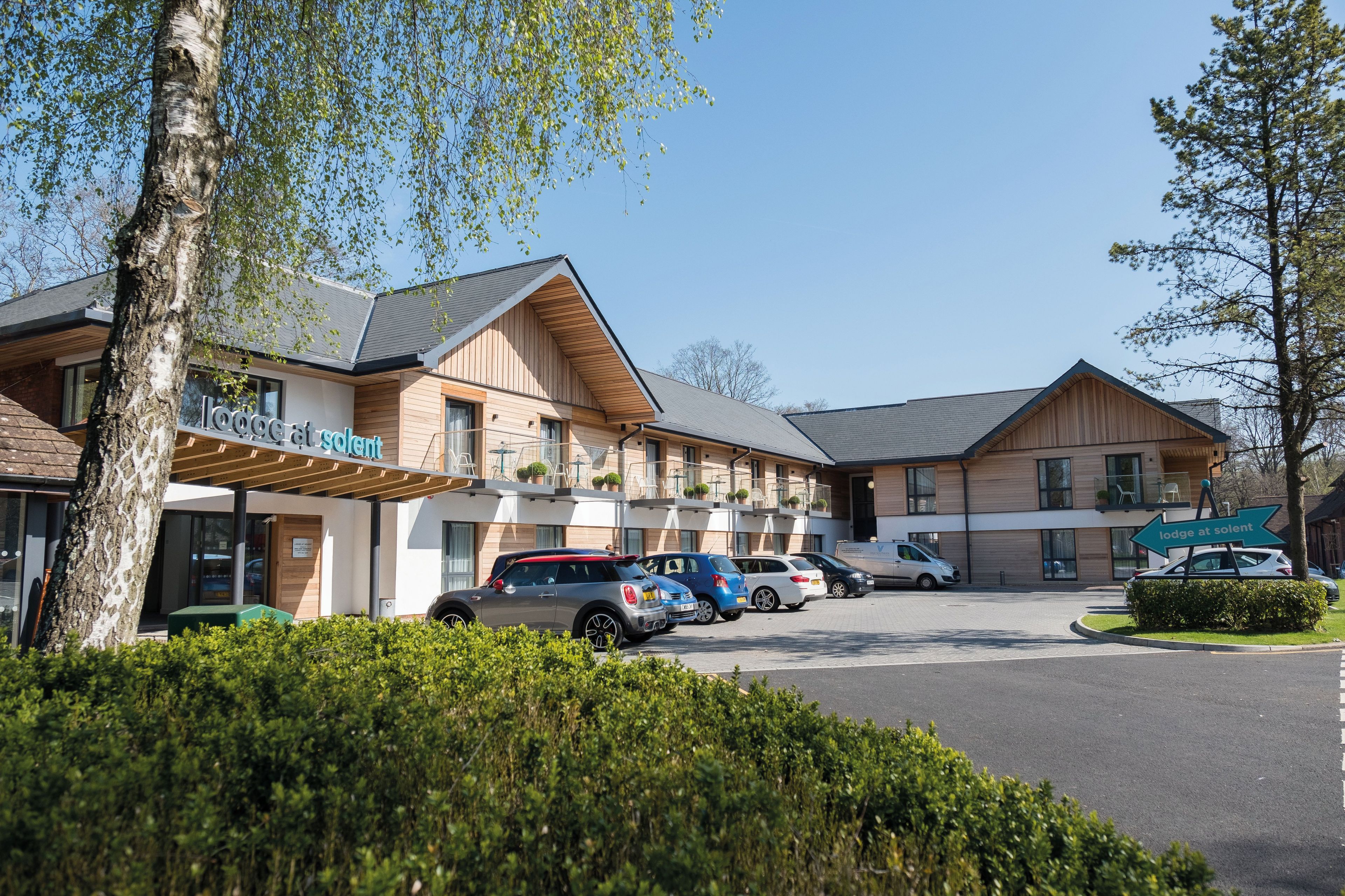 Exterior of Lodge at Solent car park with balcony rooms